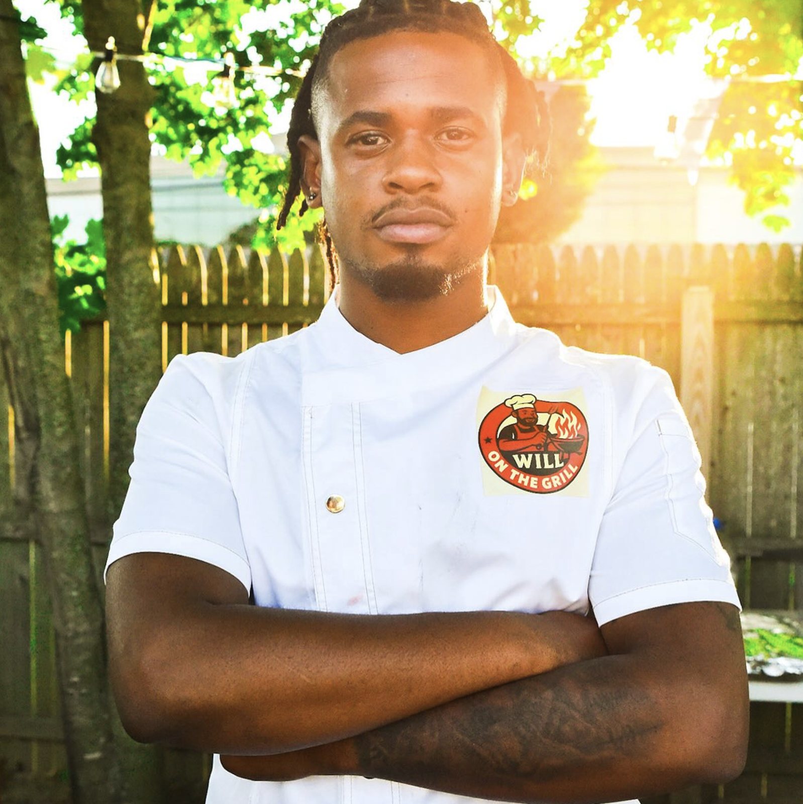 Will OTG chef portrait in branded chef jacket outdoors